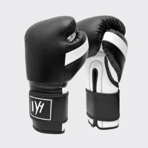 Angled view of MAYHM Premium Boxing Gloves in black and white with reinforced wrist support and shock-absorbing padding for boxing training and sparring.